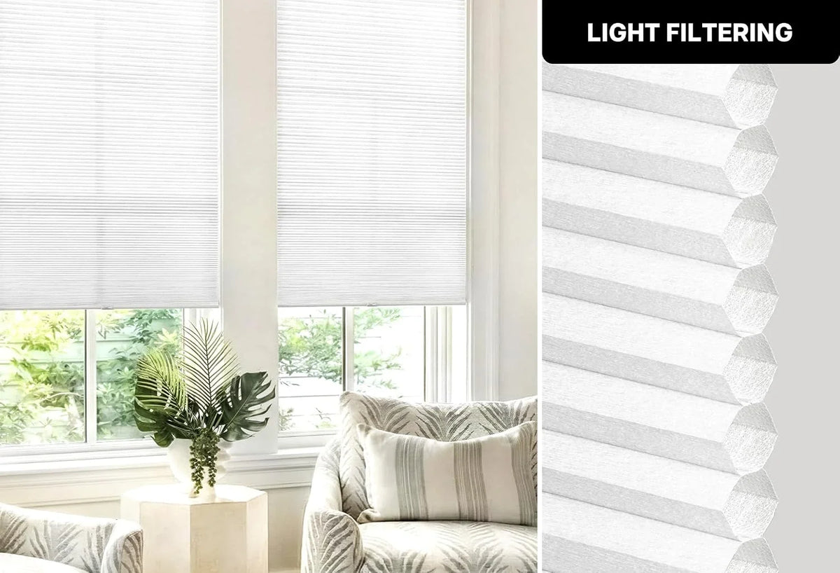 Light filtering window blinds in a room with a couch and plant