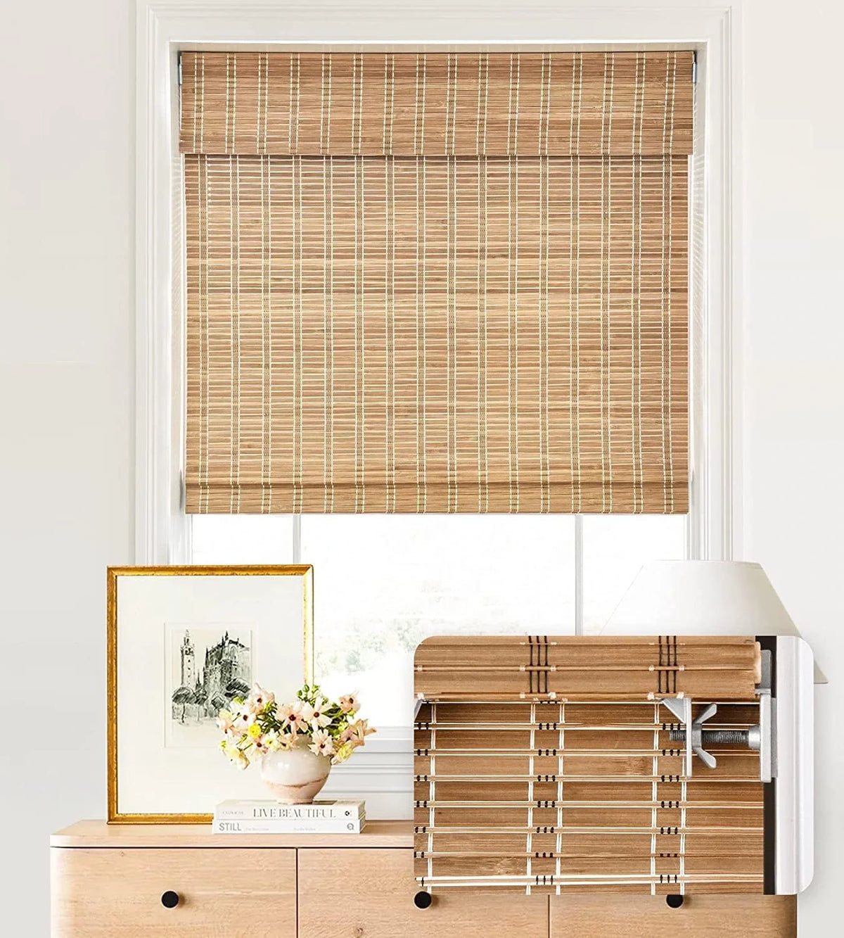 A brown206 woven bamboo roller blind mounted on a window, shown in a styled home interior setting with a wooden dresser, lamp, and framed picture below.