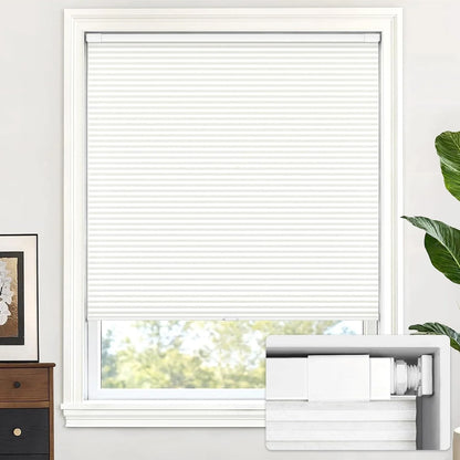 Window with white blinds, plant, and dresser in a room setting