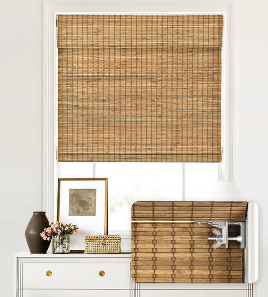 Woven bamboo blinds on a window with a white frame and decorative items below.