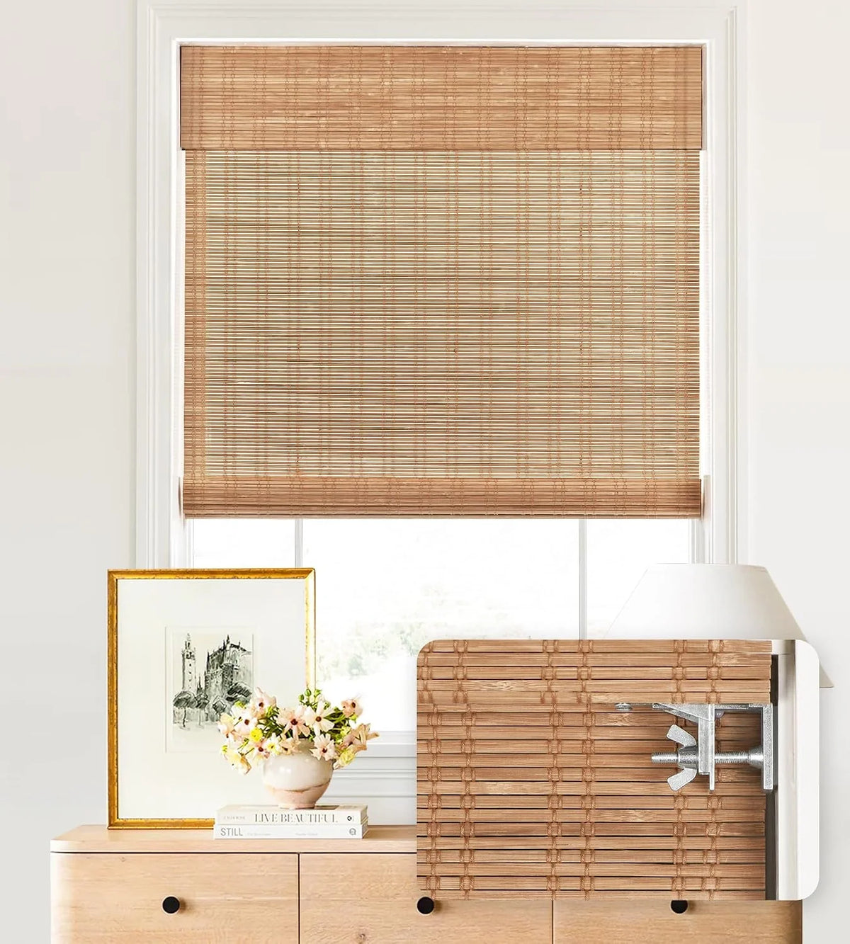 Bamboo window blinds with a decorative frame and flowers on a white wall.