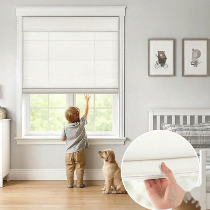 A white roller blind installed on a window in a bright nursery, with a child reaching up to adjust it and a dog sitting nearby. A circular inset shows a close-up of the white fabric texture.